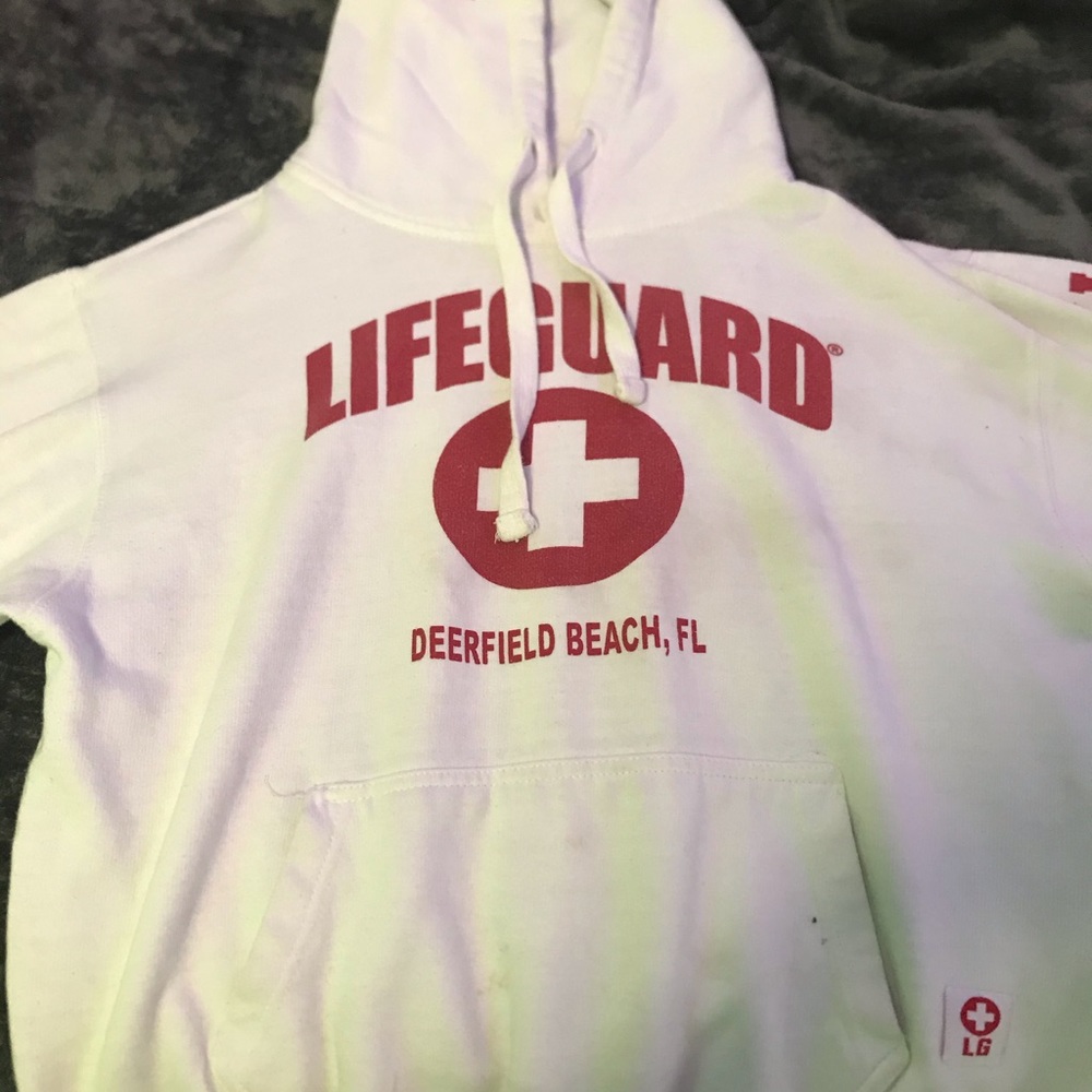 white and red lifeguard hoodie.